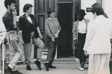 Six members/workers from the Greenwich Lesbian and Gay Centre talking outside West Greenwich House during the Grand Tea Dance/AGM of 1988