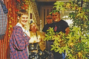 Group of four Metro Centre staff and service users at World Mental Health Day event, 1998