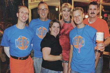 A group of six Metro staff at a fundraising event, some wearing branded t-shirts at the Rose and Crown pub, Greenwich, 2006