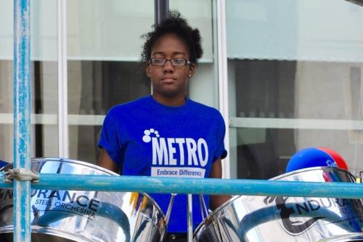 Young person playing steel pans