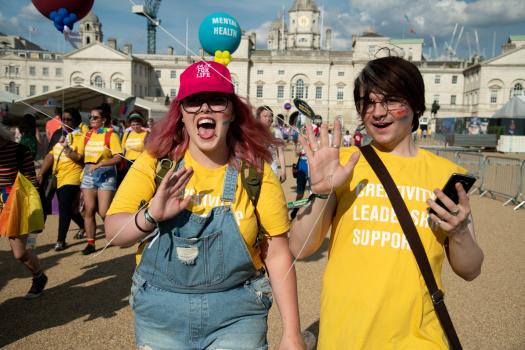 Two young people wearing METRO youth t-shirts after Pride in London