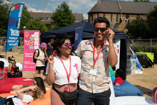 Staff from SASH in front of the METRO stall at Essex Pride