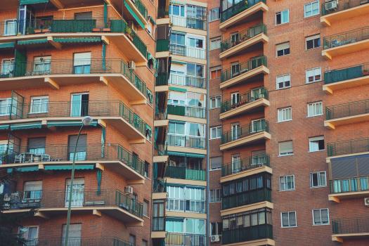 View of a block of flats with many windows and balconies