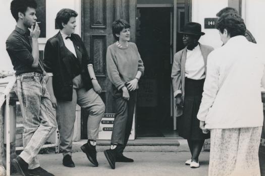 Six members/workers from the Greenwich Lesbian and Gay Centre talking outside West Greenwich House during the Grand Tea Dance/AGM of 1988