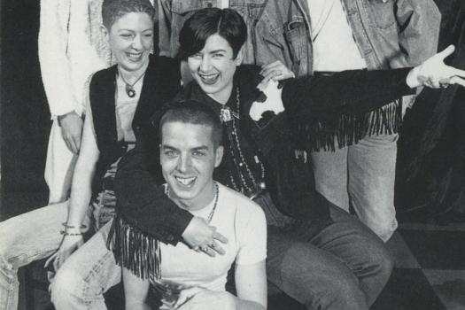 Group of six people smiling and posing in a photoshoot for volunteers at The Metro Centre, 1995