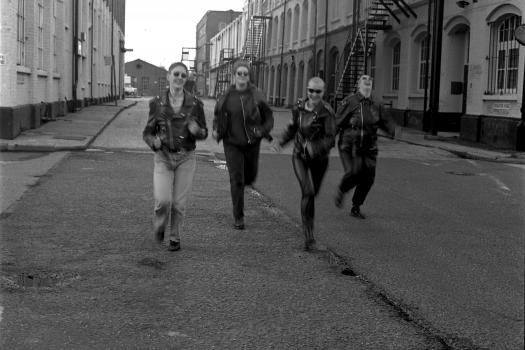 Four volunteers running for a photoshoot for The Metro Centre in Charlton, 1994