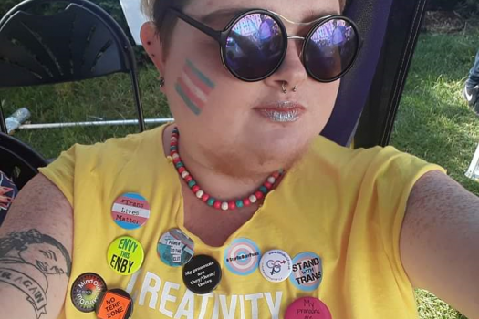 Our Alex wearing sunglasses at Pride