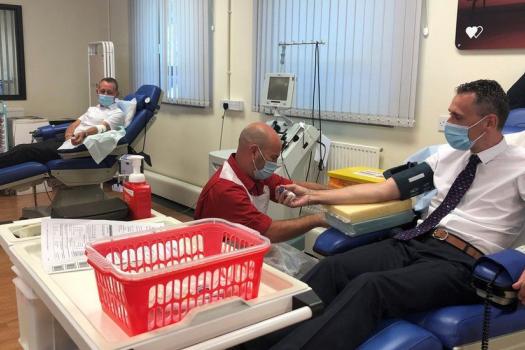 Gay couple donating blood together