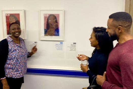 Three people at our Black History Month exhibition in 2019