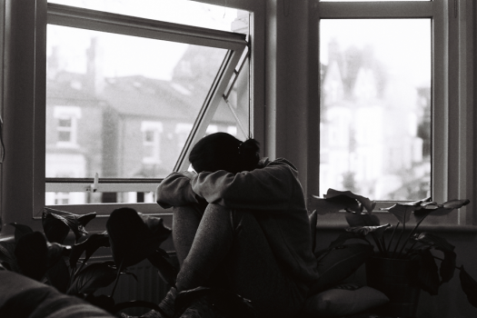 black and white photo of a person looking depressed