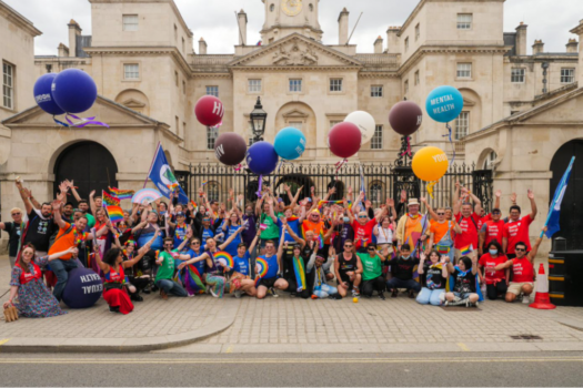 Photo of the METRO entry for Pride in London 2022, posing outside Horse Guards on Whitehall